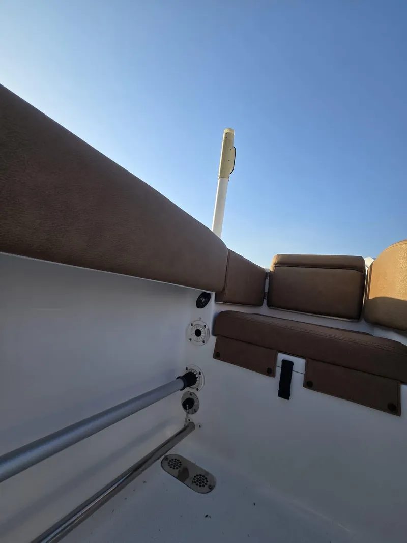 Slide: The Image of 2022 Sea Hunt Gamefish 30 Forward Seating, interior view with cushions and clear sky. - 6