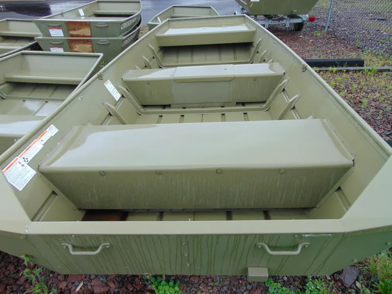Slide: The Image of 2024 Crestliner 1448M CR Jon boat, olive green, parked outdoors. - 4