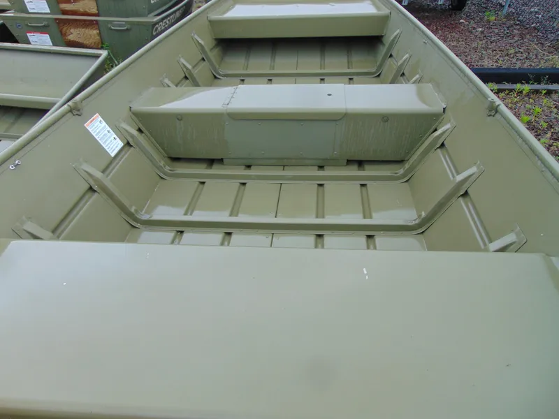 Slide: The Image of 2024 Crestliner 1448M CR Jon boat interior, featuring durable seating and spacious layout. - 5