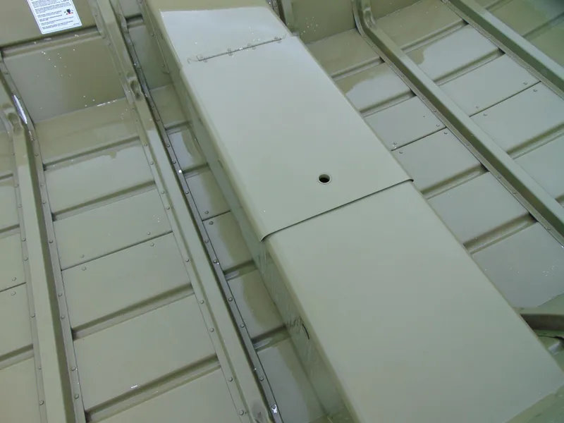 Slide: The Image of 2024 Crestliner 1448M CR Jon boat interior with bench seating and storage compartment. - 7