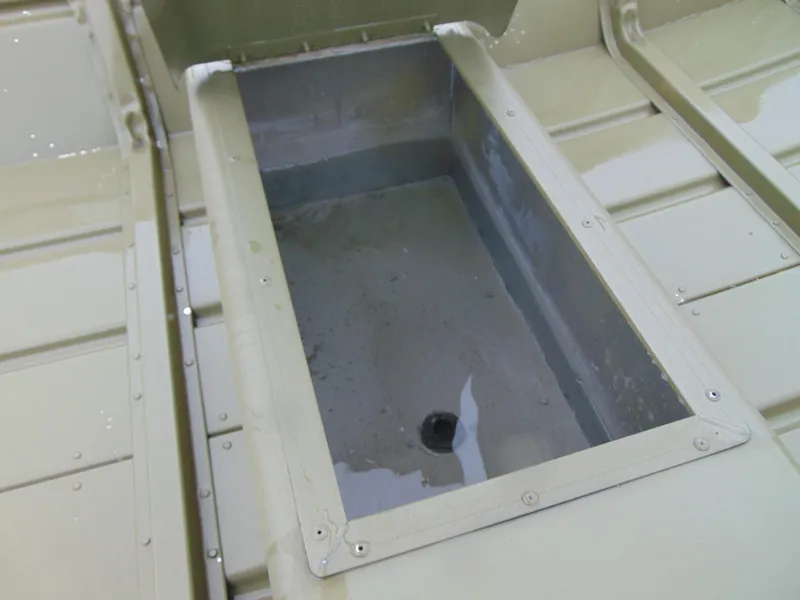 Slide: The Image of 2024 Crestliner 1448M CR Jon boat interior with open storage compartment. - 8