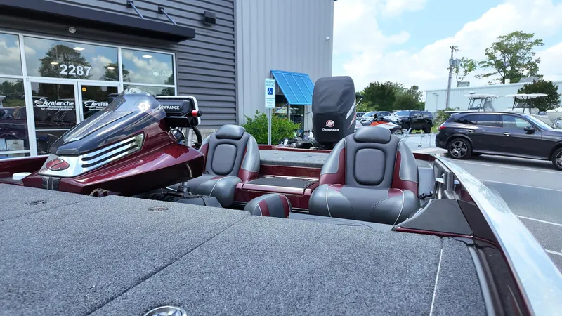 Slide: The Image of 2018 Ranger Z 518c boat with dual seats and sleek design, parked outside a dealership. - 10