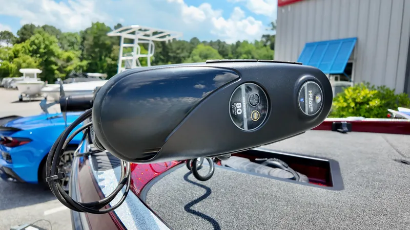Slide: The Image of 2018 Ranger Z 518c boat with mounted trolling motor, outdoors on a sunny day. - 11