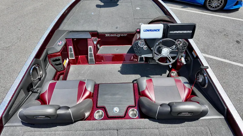Slide: The Image of 2018 Ranger Z 518c boat interior with dual seats, steering wheel, and navigation equipment. - 3