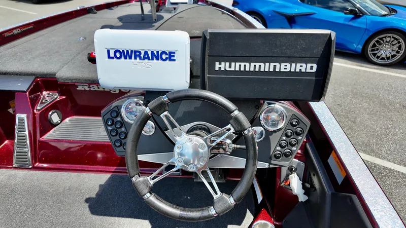 Slide: The Image of 2018 Ranger Z 518c boat dashboard with Lowrance and Humminbird navigation systems. - 4