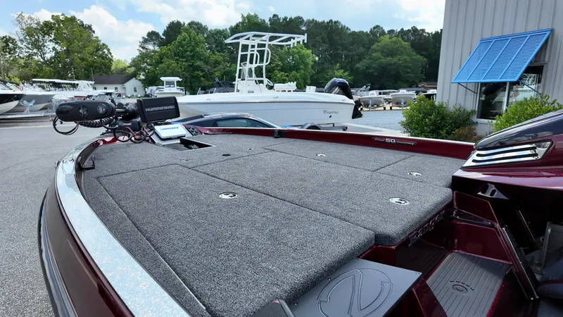 Slide: The Image of 2018 Ranger Z 518c boat with carpeted deck, docked outdoors. - 9