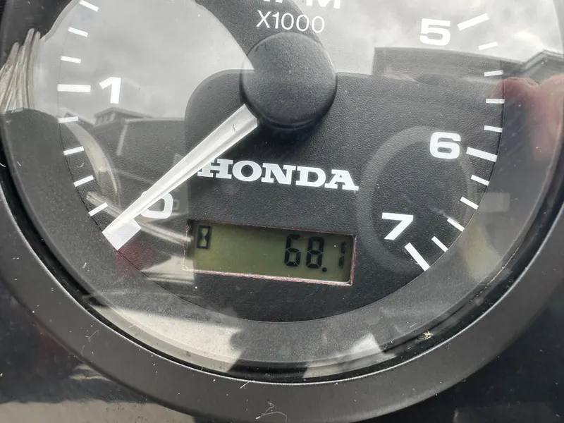Slide: The Image of Tachometer displaying 68.1 hours on a Honda engine, Grand Inflatables G380, 2022 model. - 13