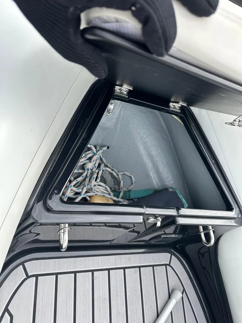 Slide: The Image of Storage compartment on 2022 Grand Inflatables G380 boat with rope inside. - 16
