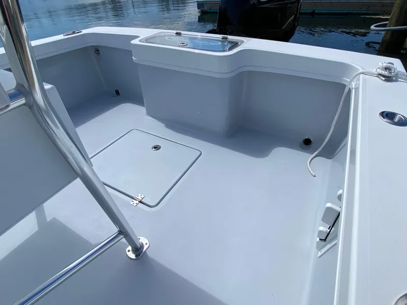 Slide: The Image of 2023 Pair Customs 21 Center Console DV boat interior with sleek design and storage features. - 12