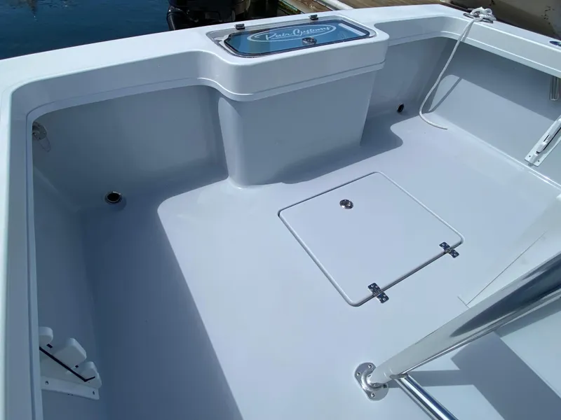 Slide: The Image of 2023 Pair Customs 21 Center Console DV boat interior with storage hatch. - 13