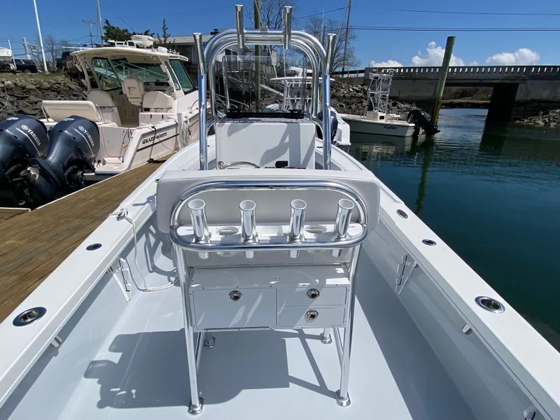 Slide: The Image of 2023 Pair Customs 21 Center Console DV boat docked by the water. - 15