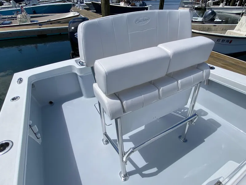 Slide: The Image of 2023 Pair Customs 21 Center Console DV boat with white seating and sleek design. - 16