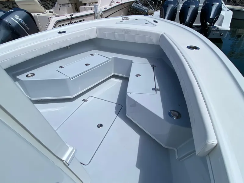 Slide: The Image of 2023 Pair Customs 21 Center Console DV boat interior with seating and storage compartments. - 18
