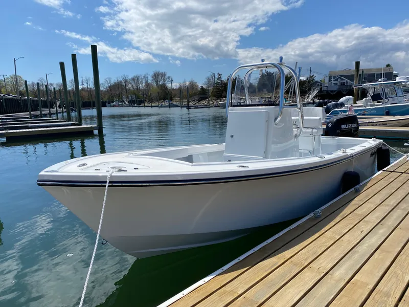 Slide: The Image of 2023 Pair Customs 21 Center Console DV boat docked in a marina. - 4