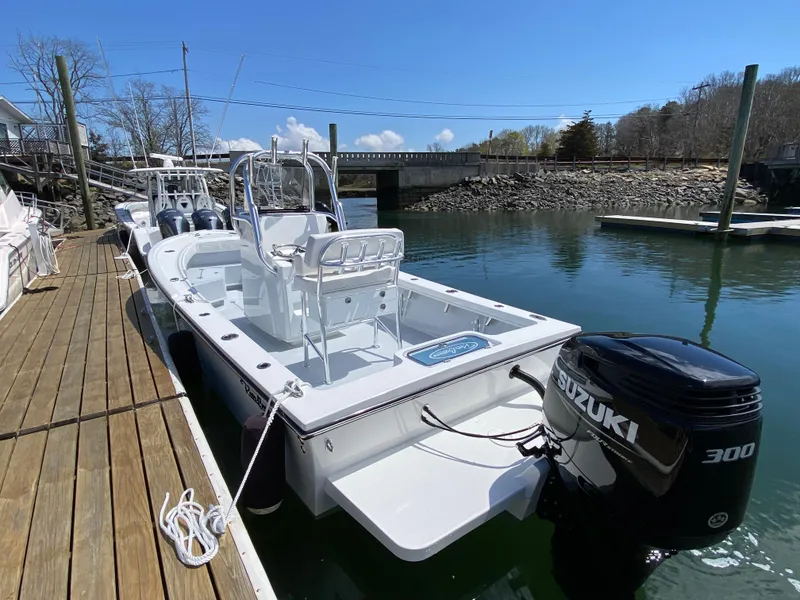Slide: The Image of 2023 Pair Customs 21 Center Console DV boat docked with Suzuki 300 engine. - 5