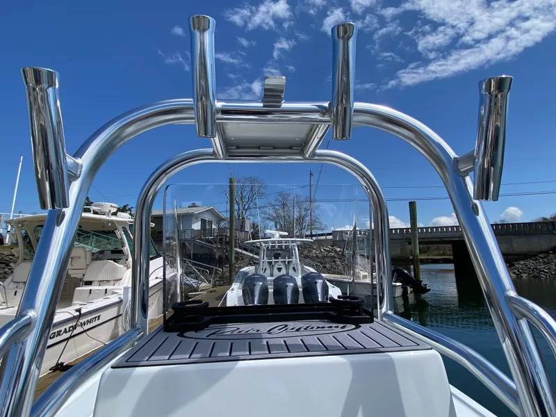 Slide: The Image of 2023 Pair Customs 21 Center Console DV boat docked under a clear blue sky. - 9