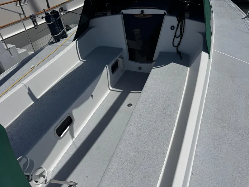 Slide: The Image of Spacious cockpit of a 2000 Wyliecat 48 sailboat, featuring sleek seating and storage compartments. - 20