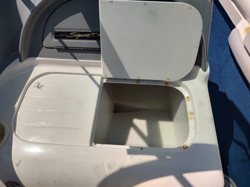 Slide: The Image of Open storage compartment on a 1994 Sea Ray 220 Bow Rider boat. - 13