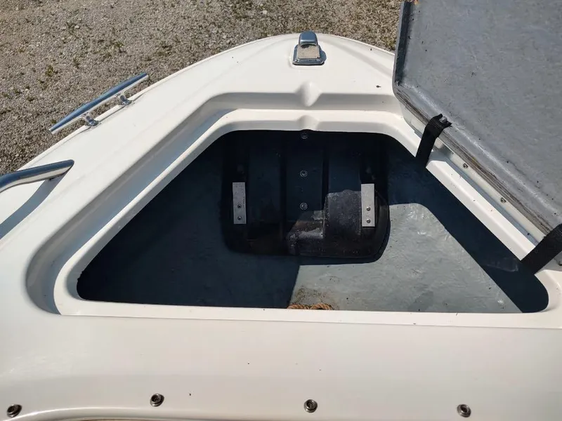 Slide: The Image of Open storage compartment on a 1994 Sea Ray 220 Bow Rider boat. - 18