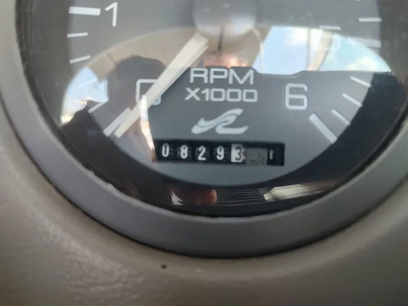 Slide: The Image of Close-up of a 1994 Sea Ray 220 Bow Rider RPM gauge showing 8293 hours. - 32