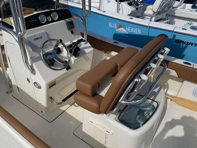 Slide: The Image of 2023 Pioneer 202 Sportfish boat interior with steering console and seating. - 5