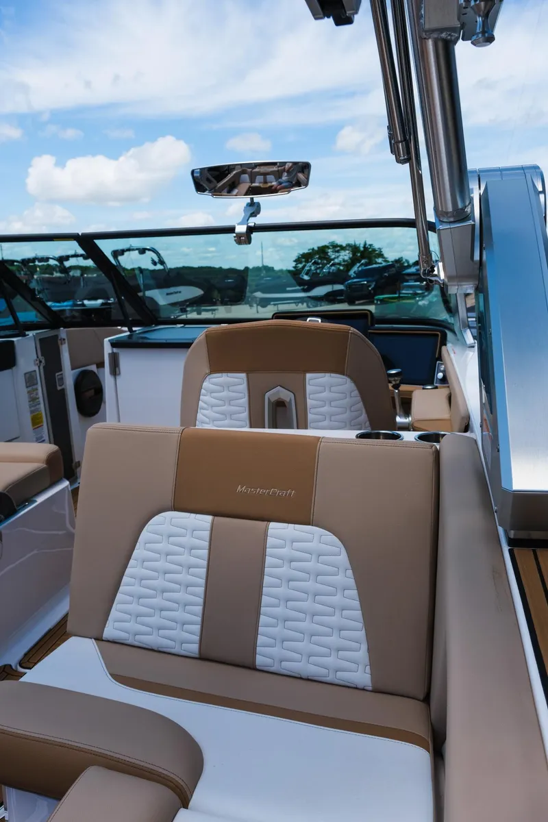 Slide: The Image of 2025 MasterCraft X26 boat interior with luxurious seating and modern design. - 19