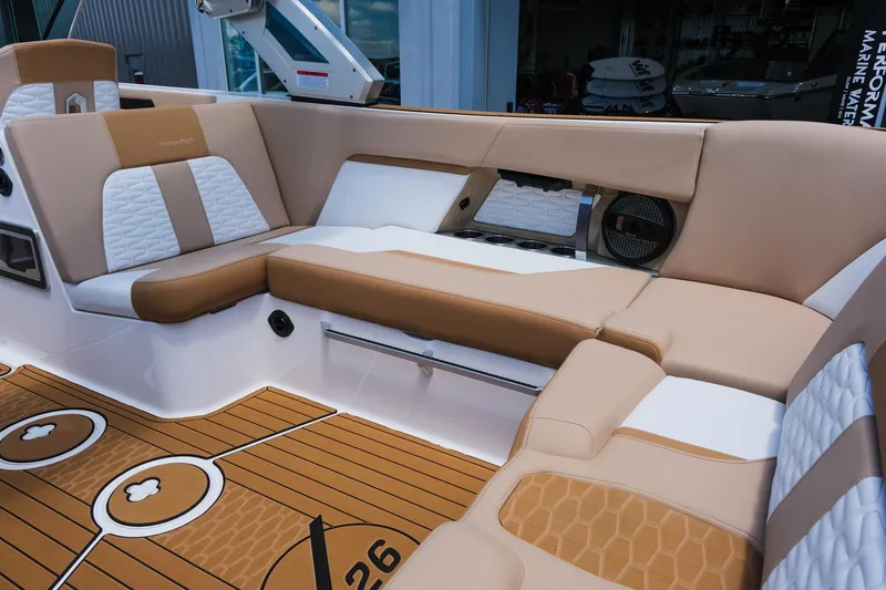 Slide: The Image of 2025 MasterCraft X26 boat interior with luxurious tan and white seating. - 20