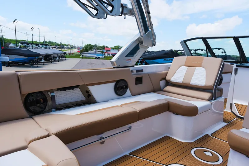 Slide: The Image of 2025 MasterCraft X26 boat interior with luxurious seating and modern design. - 21
