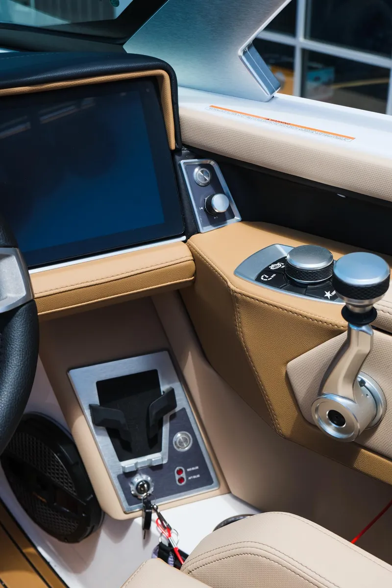 Slide: The Image of 2025 MasterCraft X26 boat interior with modern controls and touchscreen display. - 25