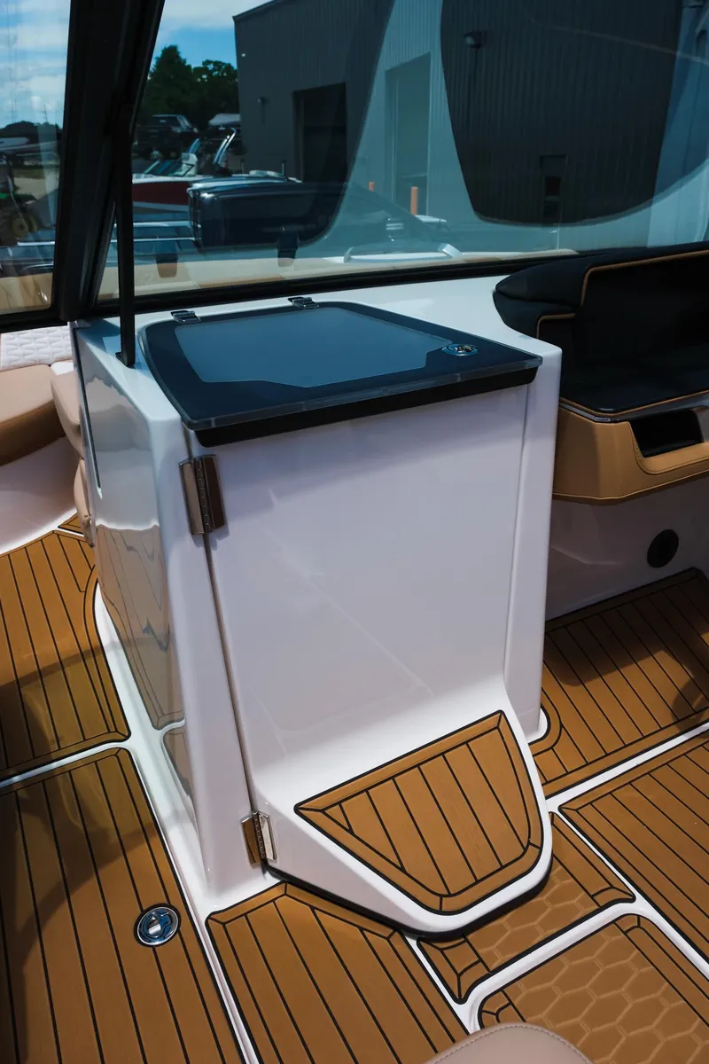 Slide: The Image of 2025 MasterCraft X26 boat interior with sleek cabinetry and teak flooring. - 28