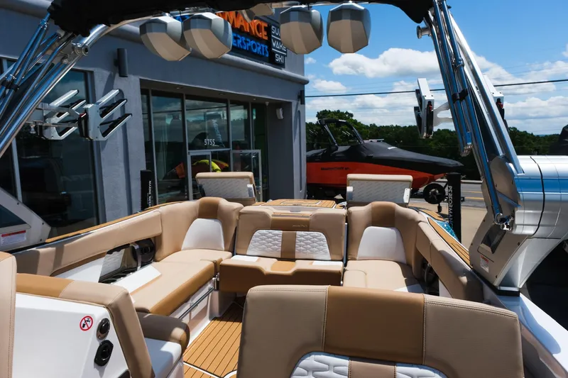 Slide: The Image of 2025 MasterCraft X26 boat interior with luxurious seating and modern design. - 33