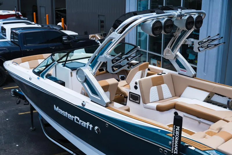 Slide: The Image of 2025 MasterCraft X26 boat with sleek design and luxurious seating. - 5