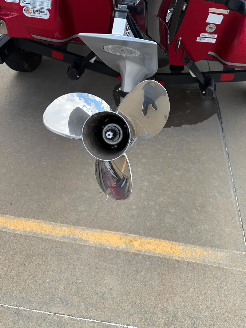 Slide: The Image of Shiny propeller of a 2020 Nitro Z18 Pro boat on concrete surface. - 10