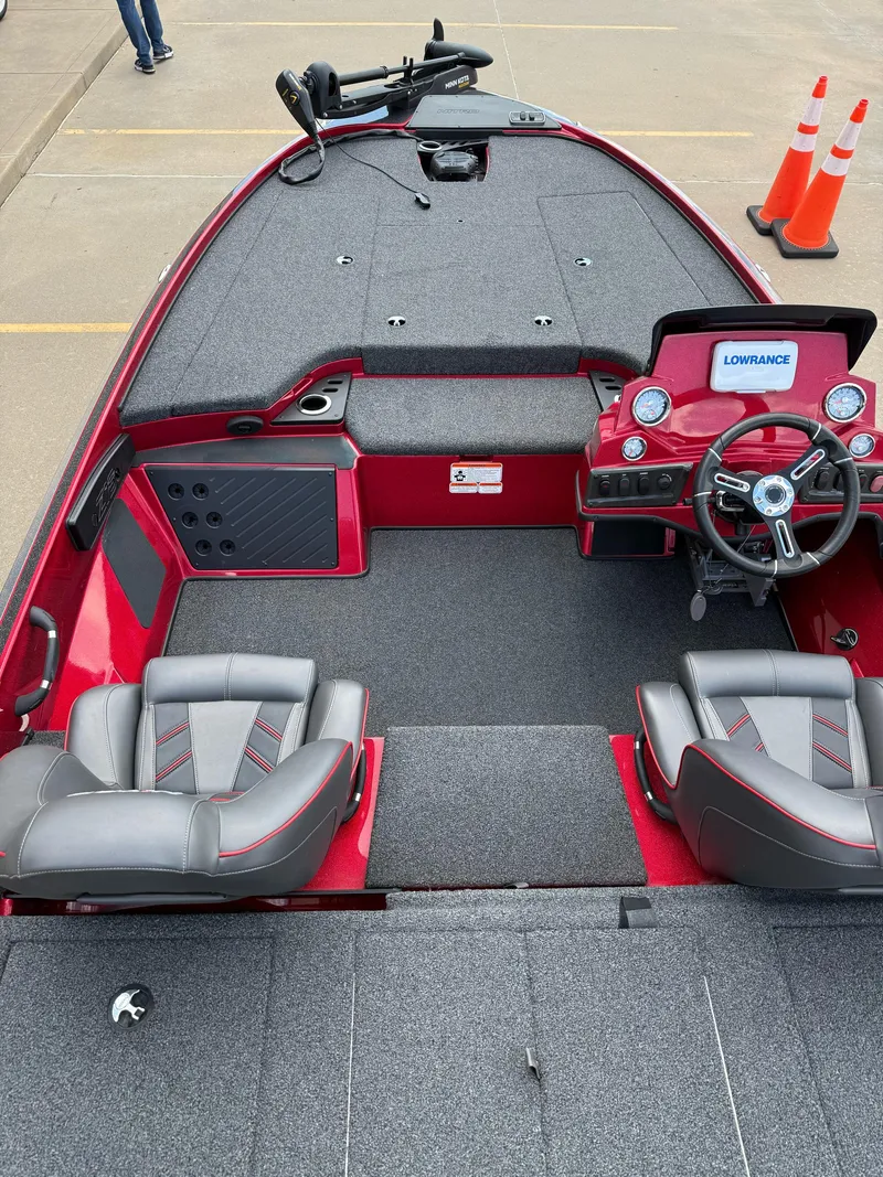 Slide: The Image of 2020 Nitro Z18 Pro boat interior with red and gray seating, steering wheel, and Lowrance electronics. - 13