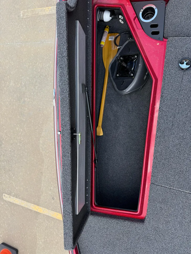 Slide: The Image of Open storage compartment in a 2020 Nitro Z18 Pro boat, showing a paddle and equipment. - 17