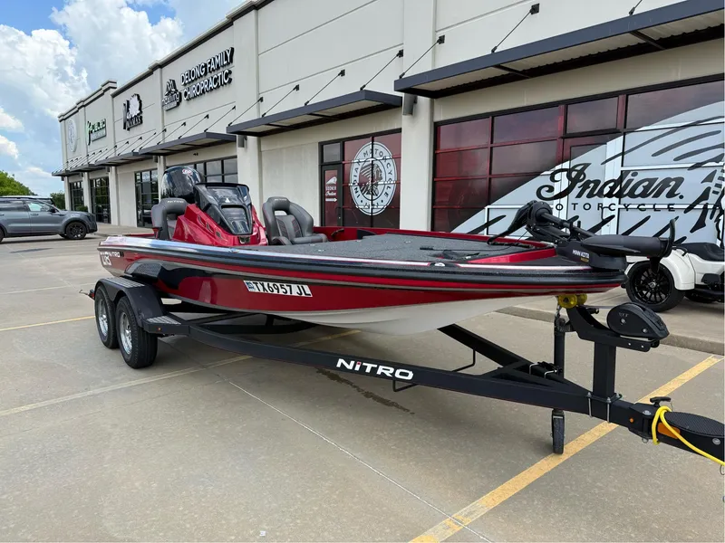 Slide: The Image of Red 2020 Nitro Z18 Pro boat on trailer, parked outside dealership. - 2