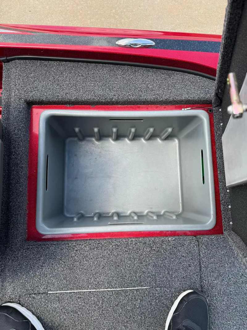 Slide: The Image of Empty storage compartment in a 2020 Nitro Z18 Pro boat, featuring gray interior and red trim. - 23