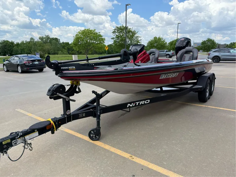 Slide: The Image of 2020 Nitro Z18 Pro boat on trailer in parking lot under cloudy sky. - 4