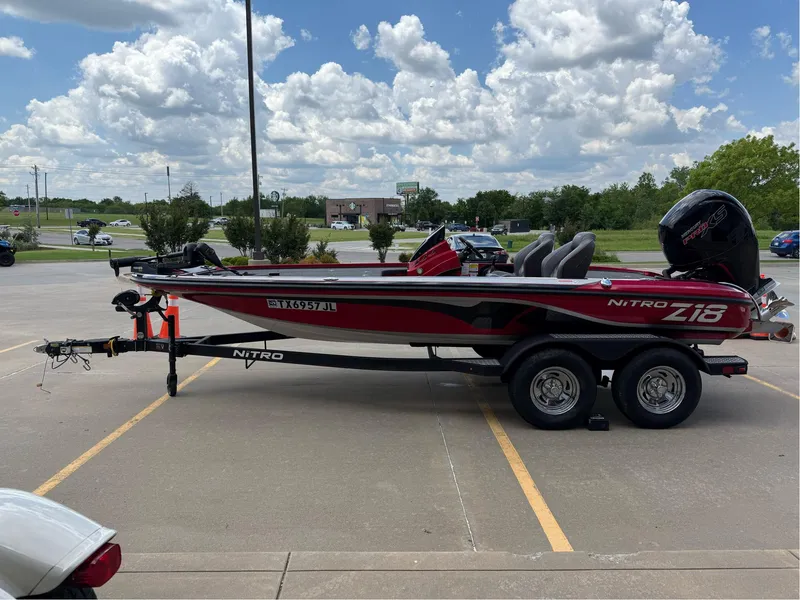 Slide: The Image of 2020 Nitro Z18 Pro boat on trailer in parking lot under cloudy sky. - 5