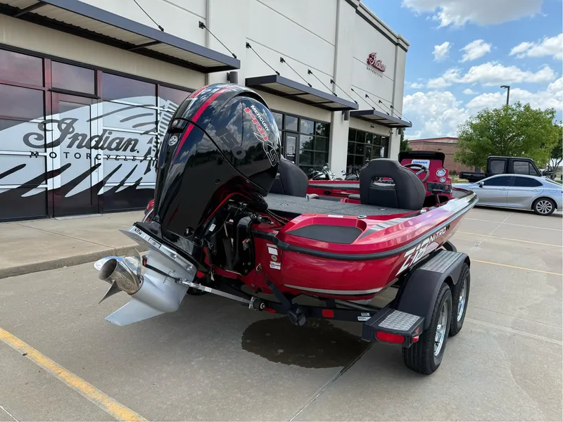 Slide: The Image of Red 2020 Nitro Z18 Pro boat parked outside dealership, showcasing powerful engine and sleek design. - 8
