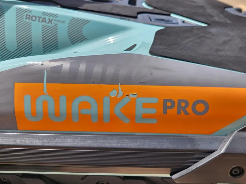 Slide: The Image of 2022 Sea-Doo Wake Pro 230 close-up with Rotax Power branding. - 11