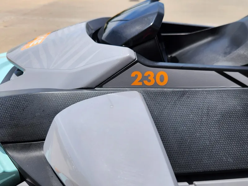 Slide: The Image of 2022 Sea-Doo Wake Pro 230 close-up, showcasing sleek design and model number. - 12