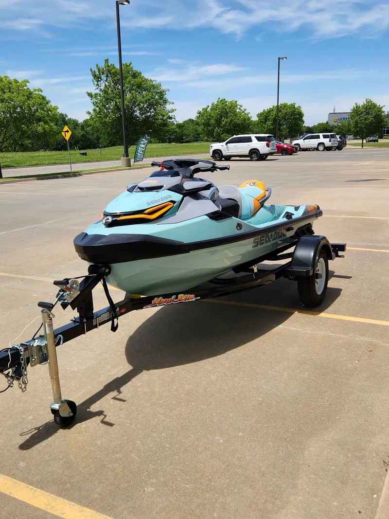 Slide: The Image of 2022 Sea-Doo Wake Pro 230 on trailer in parking lot, sunny day. - 4