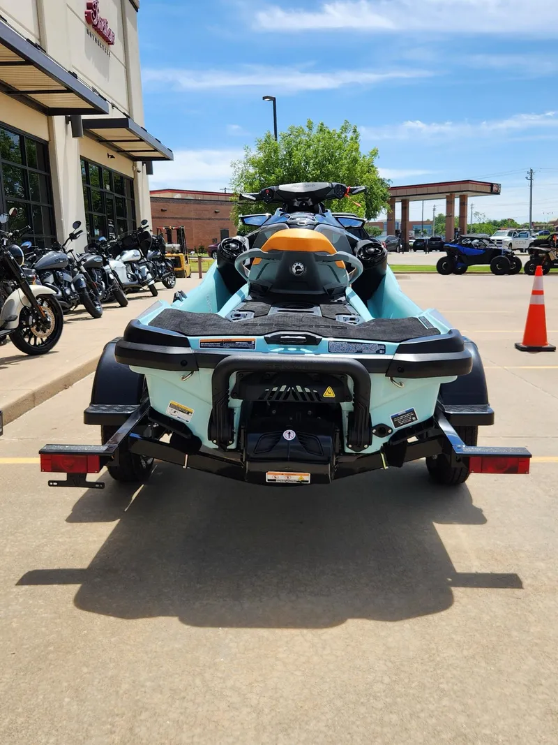 Slide: The Image of 2022 Sea-Doo Wake Pro 230 on trailer, parked outside dealership on sunny day. - 7