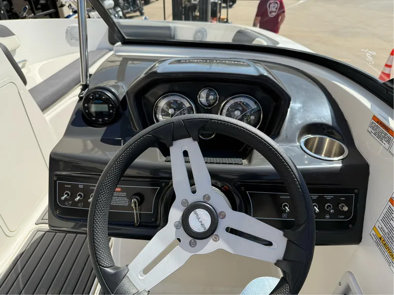 Slide: The Image of 2021 Bayliner VR5 Bowrider I/O dashboard with steering wheel and instrument panel. - 16