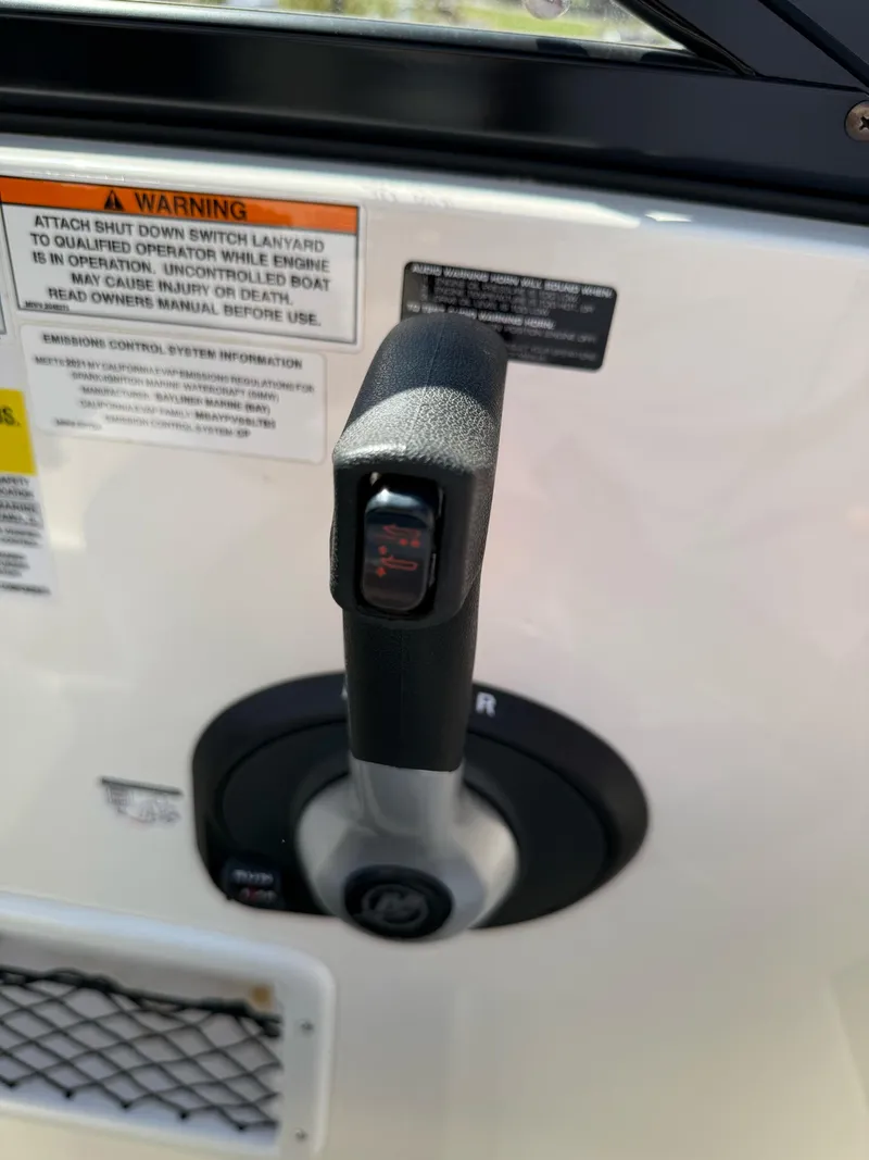 Slide: The Image of Throttle control lever on a 2021 Bayliner VR5 Bowrider I/O boat. - 17