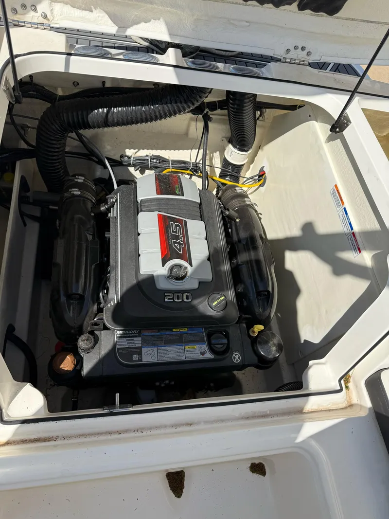 Slide: The Image of 2021 Bayliner VR5 Bowrider I/O engine compartment with Mercury 4.5L 200 HP motor. - 21