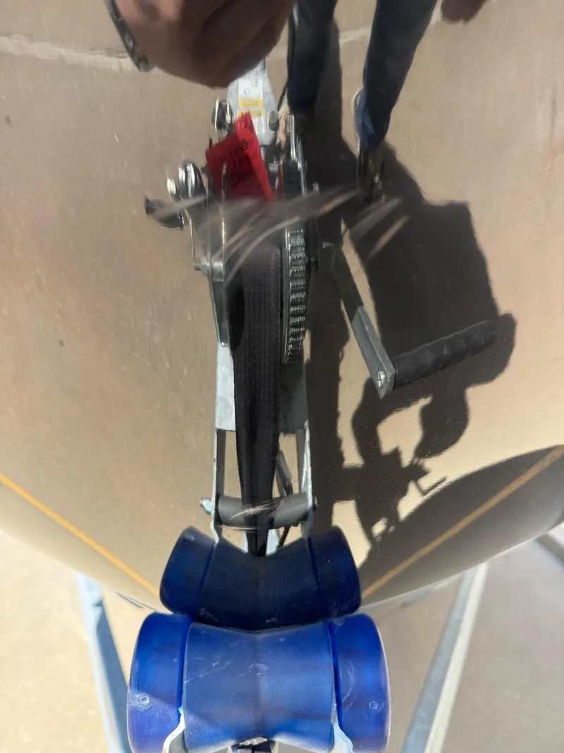 Slide: The Image of 2021 Bayliner VR5 Bowrider I/O boat trailer hitch with blue rollers. - 5