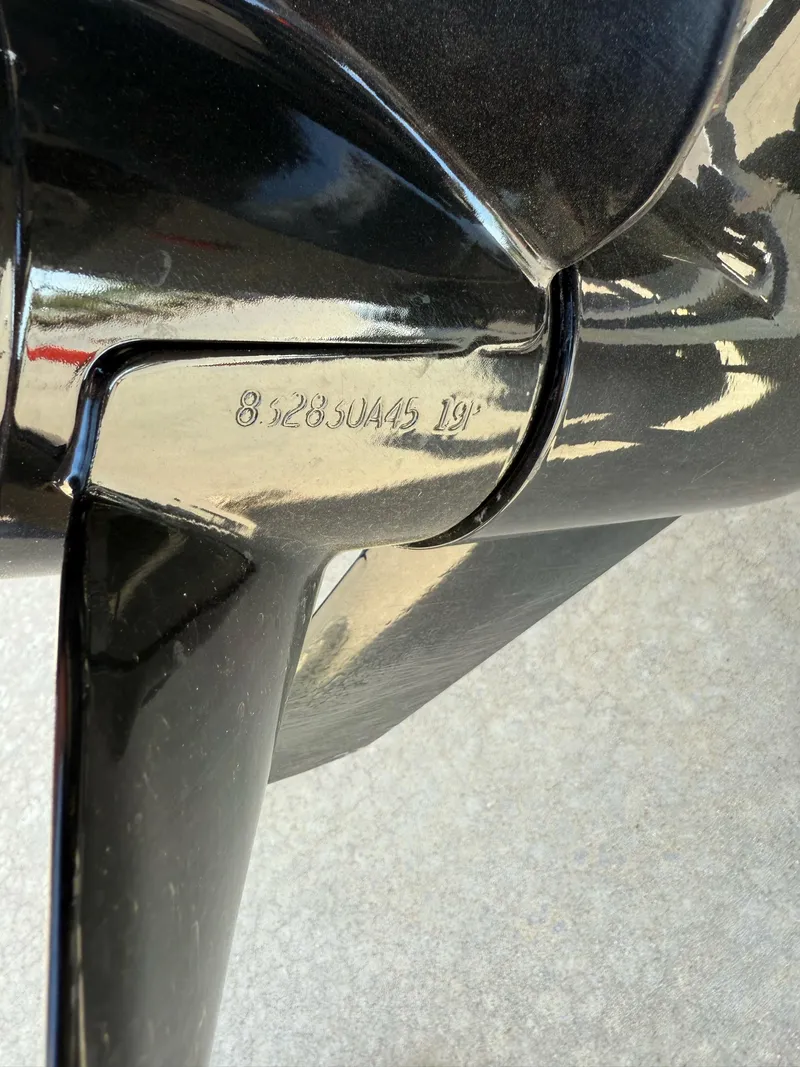 Slide: The Image of Close-up of a 2021 Bayliner VR5 Bowrider I/O propeller with engraved specifications. - 6