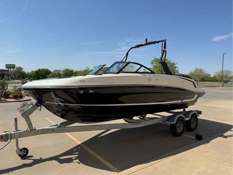 Slide: The Image of 2021 Bayliner VR5 Bowrider I/O on trailer in sunny parking lot. - 7